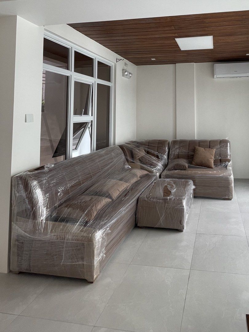 Brown L-shaped sectional sofa with matching ottoman (Category: Sofas) located in Cainta. Submitted by jordddddddd (Listing ID 1471097857, Image 2). Description: - Brown L-shaped sectional sofa set - Includes matching ottoman and scatter cushions - Upholstered in soft fabric with stylish vertical channel tufting - Spacious seating for family and guests, ideal for living rooms or lounges.