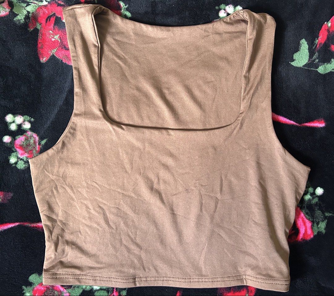 Brown Square Neck Crop Top (Category: Sleeveless) located in Manila. Submitted by coffeeislyf (Listing ID 1470989973, Image 2). Description: - Color: Brown - Style: Crop top with square neckline and thick straps - Fit: Snug, stretchy fabric - Condition: Excellent, no flaws - Styling: Great for everyday wear with high-waisted jeans or shorts.