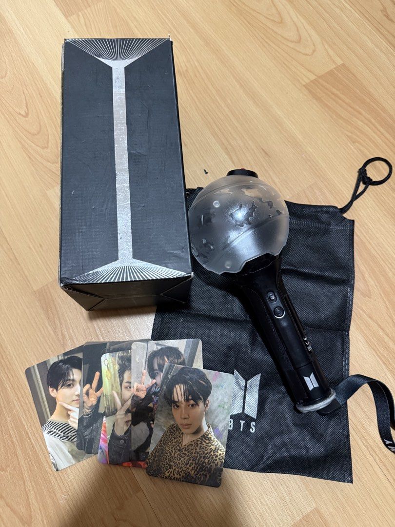 BTS Army Bomb Ver. 3 (Category: K-Wave Merchandise) located in Manila. Submitted by miksii_. (Listing ID 1471038127, Image 3). Description: - Official BTS Special Edition Army Bomb lightstick - Black handle with white globe (glows in the dark) - Tested and fully working - Includes original outer box - Includes black dust bag with silver BTS logo - Includes strap marked ARMY - Ready for concerts or display.