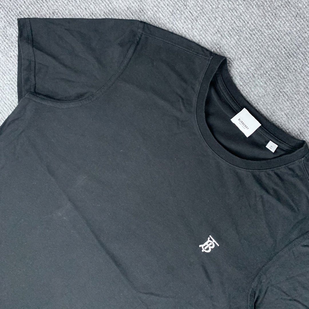Burberry Black TB Monogram T-Shirt (Category: Tshirts & Polo Shirts ) located in Baguio. Submitted by vintage_lurker (Listing ID 1471087365, Image 2). Description: Size on tag: XL fits Medium Width: 21” Length: 27” Issue/s: none Mine: 790 + Shipping fee 📍Payment first policy. no COD or COP 📍All items Washed and Sanitized 🧼 Shoot your offer. I’m all ears‼️ OTHER DETAILS: - Brand: Burberry - Color: Black - Size: XL - Design: Classic crewneck wit