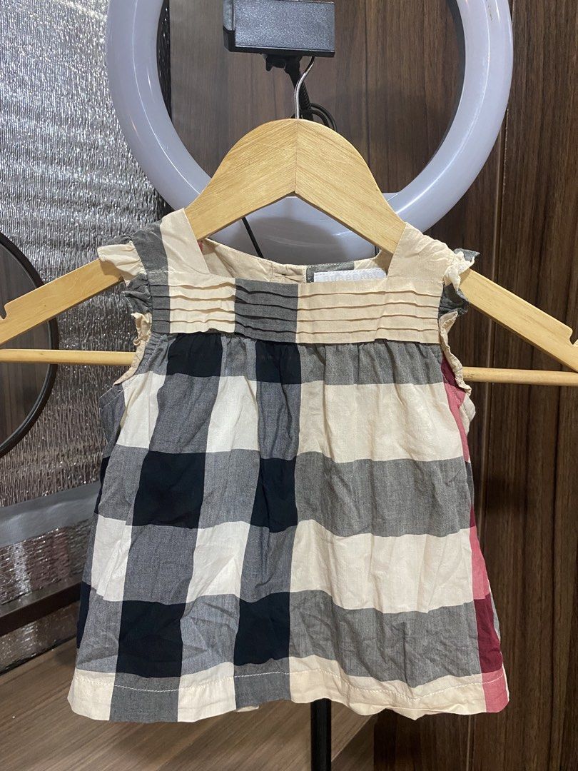 Burberry Children Check Top 18M (Category: Babies & Kids Fashion) located in Bulacan. Submitted by keiasprelovedstuff (Listing ID 1471006190, Image 1). Description: - Brand: Burberry - Size: 18M / 86cm - Material: 100% cotton (outer and lining) - super soft for toddlers - Design: Classic check pattern with cute pleated chest detail and ruffled arm openings - Origin: Made in Thailand - Condition: Great addition to any little girl's wardrobe.