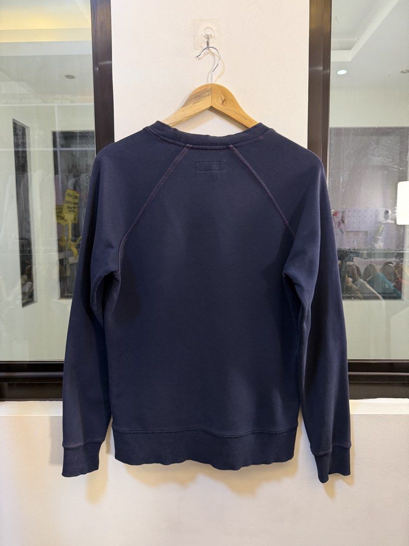 Burberry Crewneck Sweatshirt (Category: Coats, Jackets and Outerwear) located in Paranaque City. Submitted by preluxeshop_ph (Listing ID 1471014647, Image 3). Description: Brand: Burberry •Style: Raglan Crewneck Sweatshirt / Pullover •Color: Dark Navy Blue •Design Features: Embroidered red “BURBERRY London, England” script branding on the front chest, raglan sleeve construction with contrast stitching accents, classic crew neckline, and ribbed co
