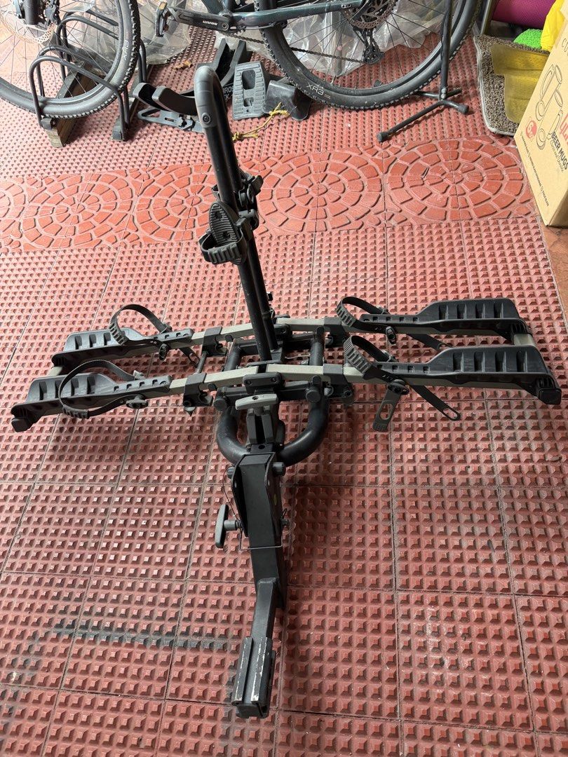Buzz Rack 2-Bike Hitch Carrier (Category: Bicycles) located in Quezon City. Submitted by rahin_2026 (Listing ID 1470954987, Image 3). Description: - Buzz Rack hitch-mounted carrier for 2 bikes - Capacity: Up to 20kg per bike - Adjustable wheel trays with secure ratchet straps - Center vertical mast with padded frame clamps - Conveniently folds flat against the vehicle when not in use - Fits standard hitch receiver connections - Sturdy constructio