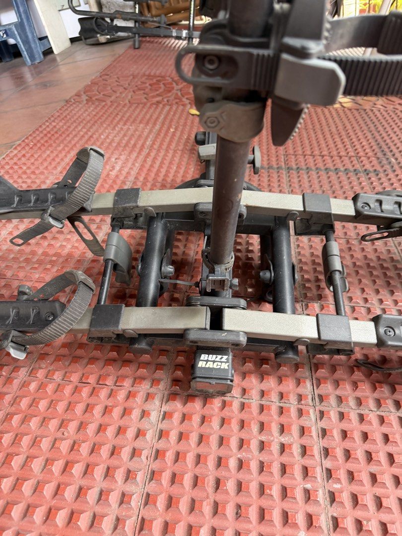 Buzz Rack 2-Bike Hitch Carrier (Category: Bicycles) located in Quezon City. Submitted by rahin_2026 (Listing ID 1470954987, Image 1). Description: - Buzz Rack hitch-mounted carrier for 2 bikes - Capacity: Up to 20kg per bike - Adjustable wheel trays with secure ratchet straps - Center vertical mast with padded frame clamps - Conveniently folds flat against the vehicle when not in use - Fits standard hitch receiver connections - Sturdy constructio