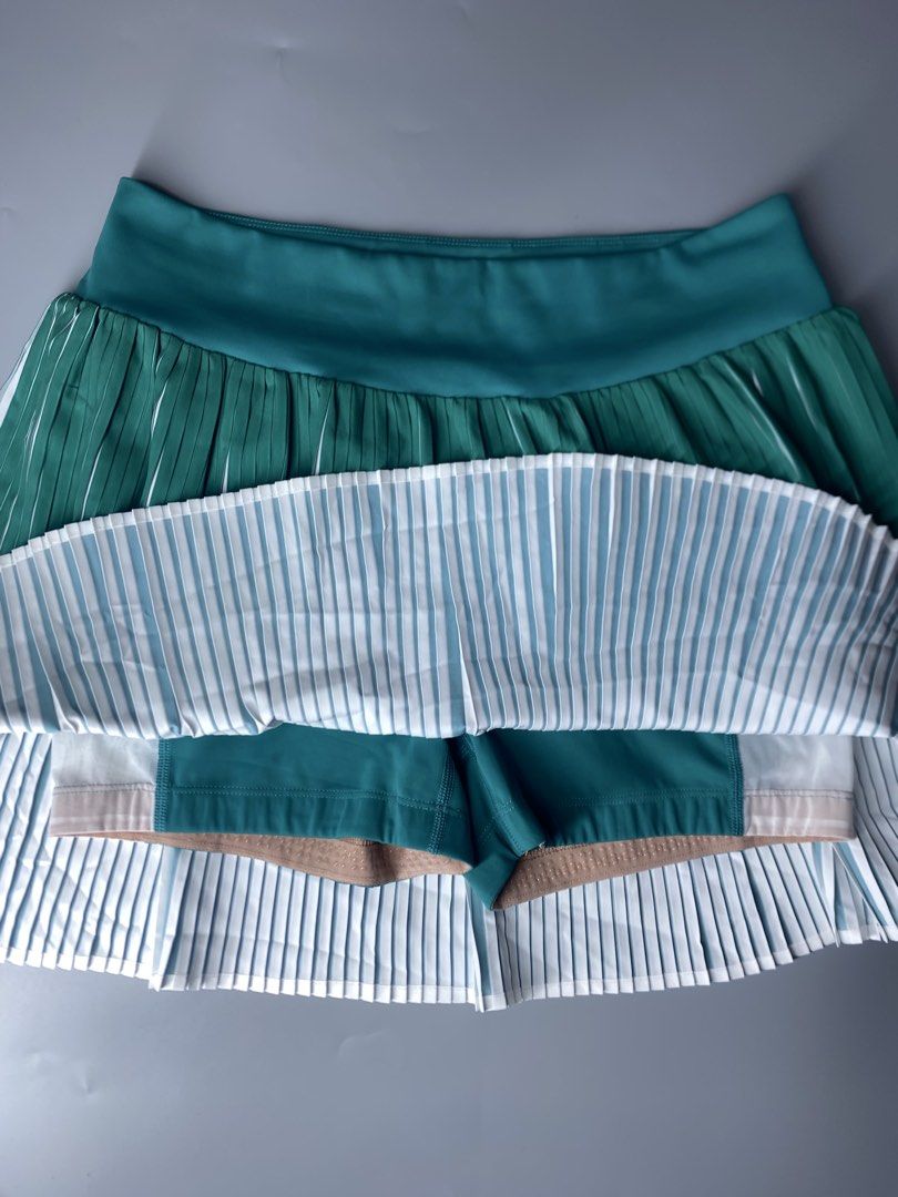 CALIA Green Pleated Athletic Skort Size M (Category: Activewear) located in Dagupan City. Submitted by vell25apparel (Listing ID 1470937445, Image 2). Description: - Brand: CALIA - Style: Athletic pleated skort with built-in shorts - Color: Teal green - Size: Medium - Features: Convenient side pockets on shorts and infinity logo emblem on waistband - Ideal for: Tennis, golf, workouts, and casual activewear.