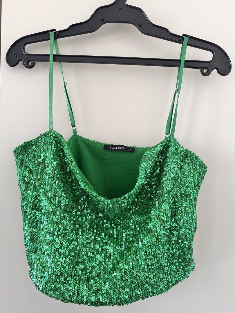 Calliope Olive Vest & Green Sequin Cami Bundle (Category: Sleeveless) located in Bacoor. Submitted by missleahloy (Listing ID 1471037658, Image 2). Description: - Brand: Calliope - Set of 2 versatile pieces - Item 1: Olive green sleeveless vest, 4 front buttons, faux pockets, Size L - Freebie: Bright green sequin cami top, thin adjustable straps, draped neckline, Size S - Condition: Clean and ready to wear No issues. The green sequin will be a fr