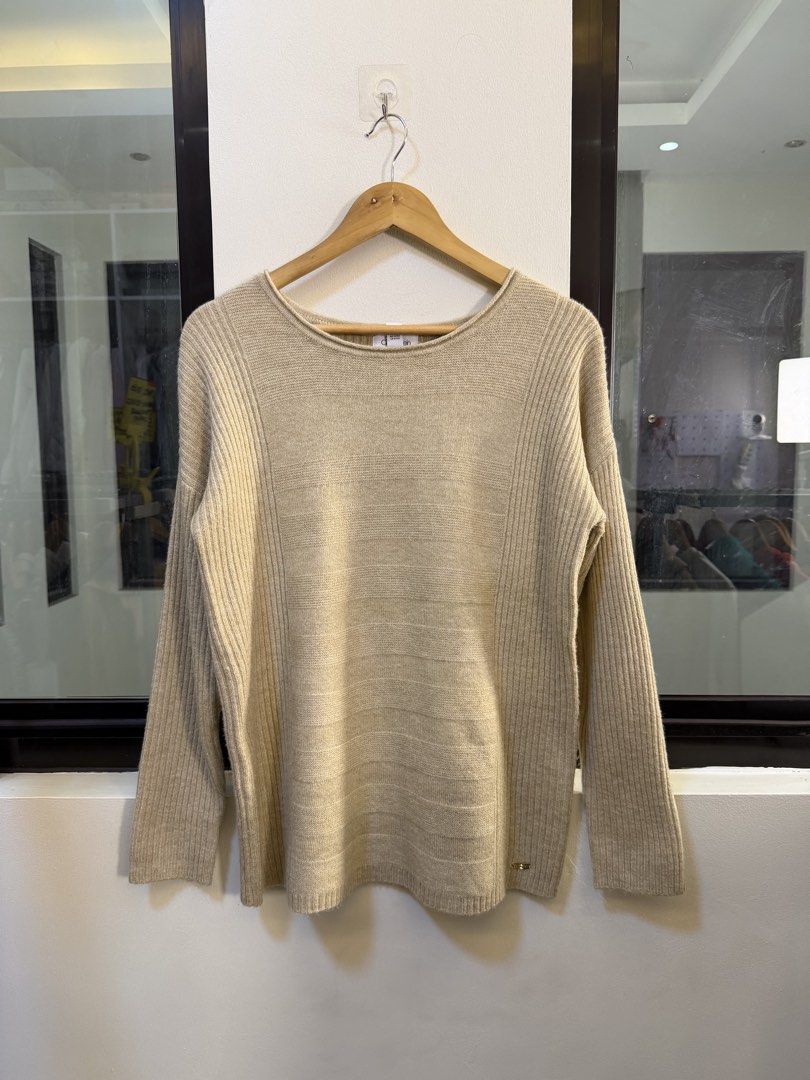 Calvin Klein Long-Sleeve Mixed-Knit Sweater (Category: Coats, Jackets and Outerwear) located in Paranaque City. Submitted by preluxeshop_ph (Listing ID 1471013328, Image 2). Description: Brand: Calvin Klein •Style: Long-Sleeve Mixed-Knit Sweater / Pullover •Color: Oatmeal / Beige •Design Features: Mixed knit pattern with horizontal texture on the center body and vertical ribbing on the sleeves and sides, boat/crew neckline, and subtle metallic br