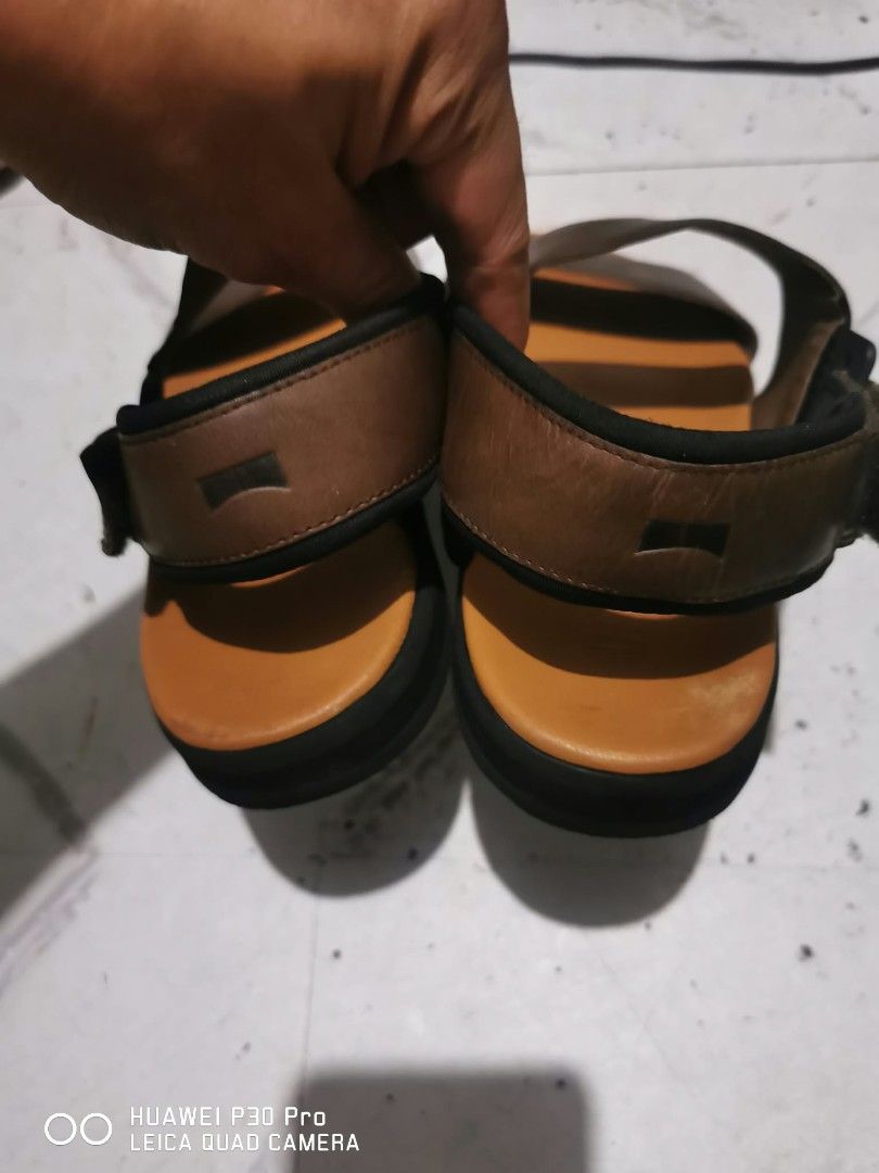 Camper Men's Brown Leather Sandals Size 42 (Category: Slippers & Slides) located in Makati City. Submitted by relianzmae57131 (Listing ID 1471050949, Image 2). Description: - Brand: Camper - Color: Brown - Size: 42 (stamped on sole) - Material: Leather with clean tan footbed - Design: Double strap with ankle strap closure - Sole: Wave tread pattern with Camper logo - Origin: Made in Vietnam - Condition: Worn with minor signs of use on the inner s