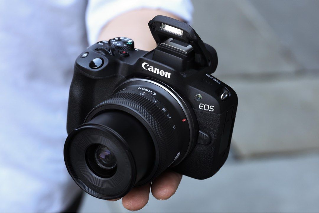 Canon EOS R50 Mirrorless Camera with RF-S 18-45mm Lens (Category: Cameras) located in Cebu City. Submitted by ahrther (Listing ID 1471097594, Image 2). Description: - Model: Canon EOS R50 Mirrorless Camera (Black) - Lens: RF-S 18-45mm f/4.5-6.3 IS STM zoom lens included - Design: Compact body with a comfortable, deep right-hand grip - Controls: Conveniently placed mode dial and power switch on the top plate - Flash: Built-in pop-up flash unit rig