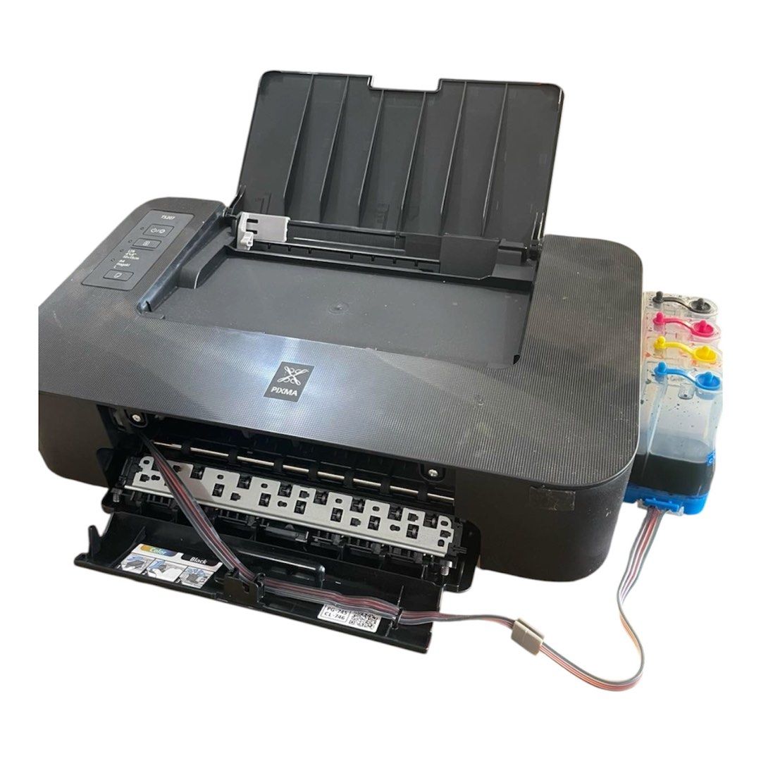Canon Pixma TS207 Inkjet Printer with CISS (Category: Printers, Scanners & Copiers) located in Muntinlupa City. Submitted by funsizedhands (Listing ID 1471003696, Image 3). Description: - Model: Canon Pixma TS207 Color Inkjet Printer - Modification: Installed with a side Continuous Ink Supply System (CISS) for low-cost printing - Inks Included: Cyan, magenta, yellow, and black tanks with tubing - Design: Compact black body with top paper tray and