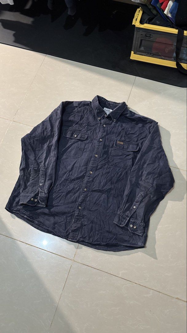 Carhartt Long Sleeve Button Down Shirt 2XL (Category: Tshirts & Polo Shirts ) located in Manila. Submitted by glano (Listing ID 1471101624, Image 1). Description: - Brand: Carhartt - Item: Long Sleeve Button-Down Shirt - Color: Navy Blue - Size: 2XL - Material: 100% Cotton (Heavy fabric weight) - Features: Dual chest pockets, leather Carhartt logo patch, button cuffs, standard collar - Condition: Excellent / Ready to wear - Mode of Payment: GCash
