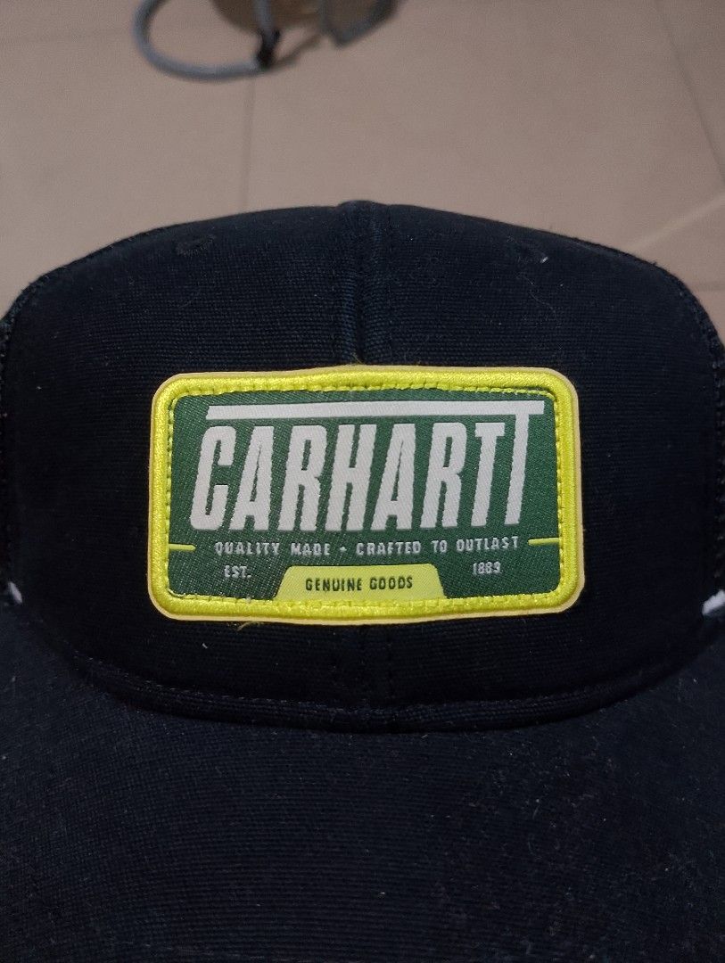 Carthoart AH0289 Black Trucker Cap (Category: Caps & Hats) located in Manila. Submitted by thriftyboyzzz (Listing ID 1470997618, Image 2). Description: - Brand: Carhartt - Color: Classic black with green and yellow logo patch - Style: Trucker hat with breathable mesh back panels - Fit: Adjustable snapback closure (Standard adult sizing) - Material: 100% cotton front panel - Condition: Excellent/New - Mode of Payment: GCash, BPI, or COD via Shopee