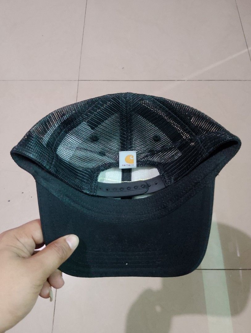Carthoart AH0289 Black Trucker Cap (Category: Caps & Hats) located in Manila. Submitted by thriftyboyzzz (Listing ID 1470997618, Image 3). Description: - Brand: Carhartt - Color: Classic black with green and yellow logo patch - Style: Trucker hat with breathable mesh back panels - Fit: Adjustable snapback closure (Standard adult sizing) - Material: 100% cotton front panel - Condition: Excellent/New - Mode of Payment: GCash, BPI, or COD via Shopee