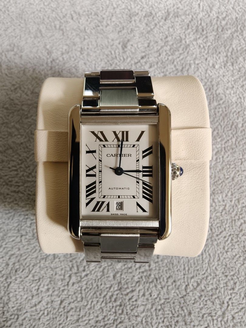 Cartier Tank solo Xl 2017 (Category: Luxury Watches) located in Quezon City. Submitted by rafmag2484 (Listing ID 1471022572, Image 2). Description: Cartier Tank Solo XL 2017 Original box and card Reference Number: W5200028 Movement: Automatic self-winding Case & Bracelet: Stainless steel with rectangular links Dial: white opaline dial with black Roman numerals, blued-steel sword-shaped hands, and a date window at the 6 o'clock position. Crown: Be
