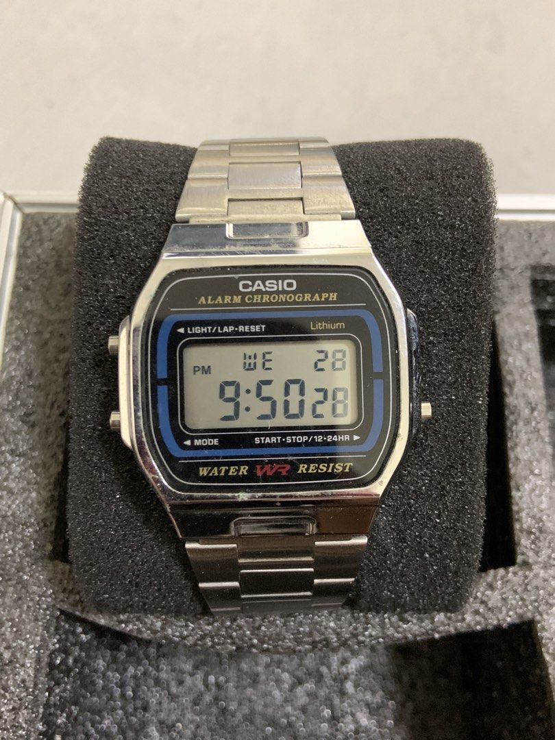 Casio Alarm Chronograph Digital Watch (Category: Men's Watches) located in Manila. Submitted by relokado (Listing ID 1470938373, Image 1). Description: - Model: Casio vintage digital watch with silver-tone stainless steel bracelet - Display: Clear LCD screen featuring a stylish blue accent line around the dial - Functions: Alarm, chronograph, weekday, and date display - Durability: Water-resistant design with standard side push buttons - Conditio