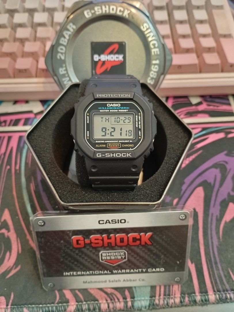Casio G-Shock DW-5600E Digital Watch (Category: Men's Watches) located in Manila. Submitted by jcaseanti (Listing ID 1470941931, Image 1). Description: - Model: Casio G-Shock DW-5600E (Module 3229) - Condition: Clean, fully tested, and working properly - Design: Classic square digital watch with black resin strap and bezel - Key Features: Shock-absorbing structure, 200m water resistance, and electro-luminescent backlight - Inclusions: Original G-