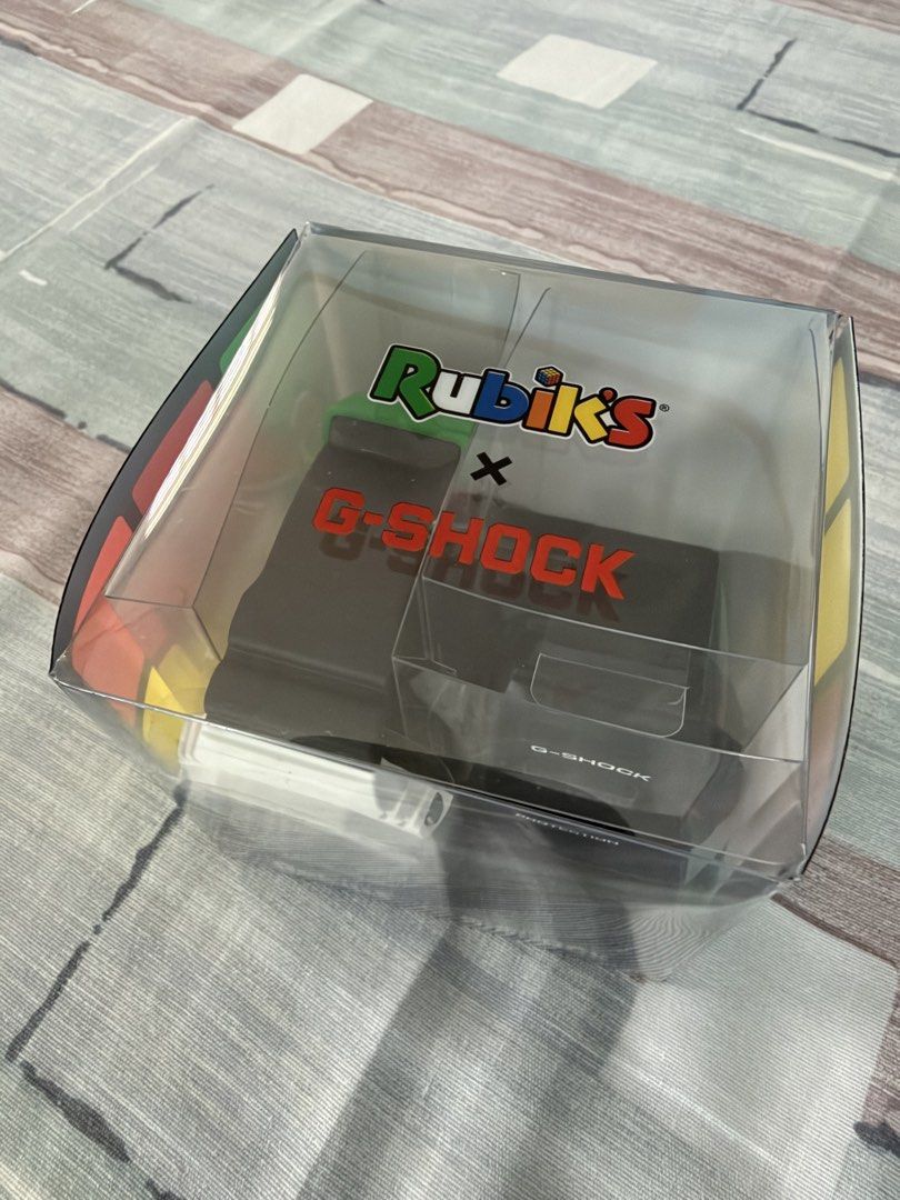 Casio G-Shock Rubik's Limited Edition Japan release (Category: Men's Watches) located in Binan City. Submitted by bossv1c (Listing ID 1471005102, Image 2). Description: • Model: Casio G-Shock x Rubik's Cube GAE-2100RC-1AJR (Japan) • Brand new condition, unused and just kept in the closet • original Rubik's cube-shaped special packaging box • Complete with all original accessories including watch module manual with Japanese warranty paper stamped 