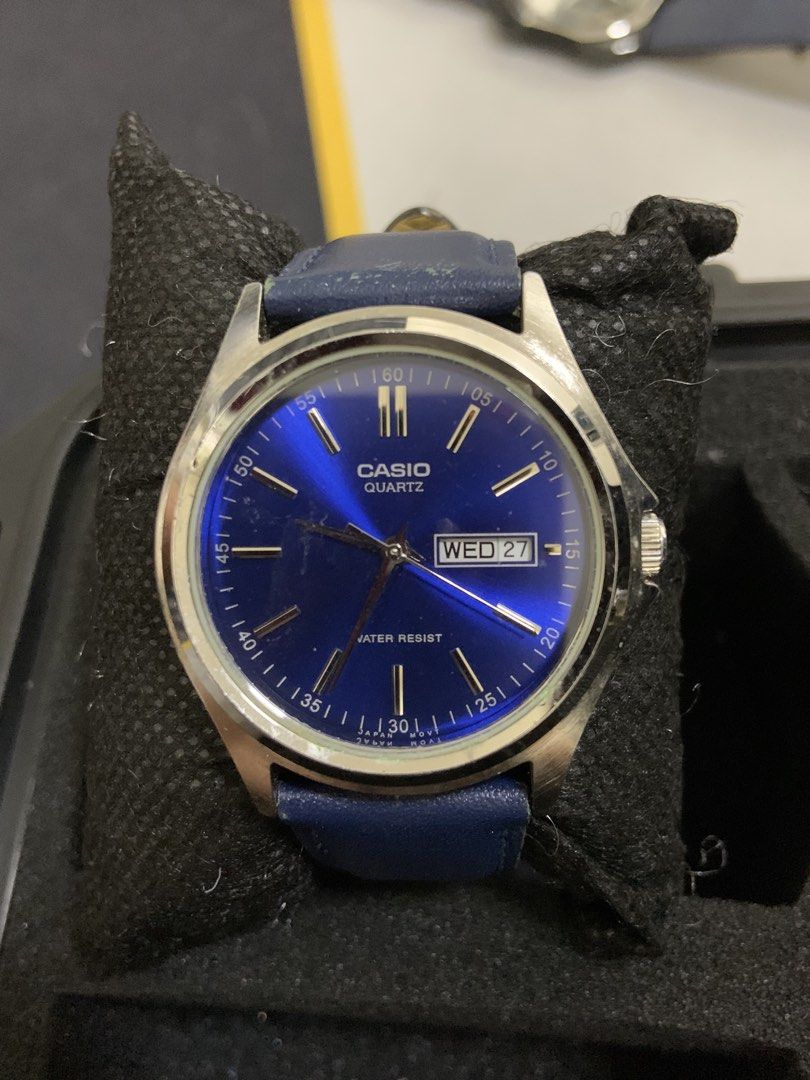 Casio Quartz Blue Dial Watch with Leather Strap (Category: Men's Watches) located in Manila. Submitted by relokado (Listing ID 1470937899, Image 1). Description: - Brand: Casio - Movement: Reliable quartz - Dial: Striking blue sunburst with silver-tone hands and hour markers - Features: Day and date window at 3 o'clock position, water-resistant - Materials: Stainless steel case and blue leather strap - Condition: Runs great, minor wear on the str