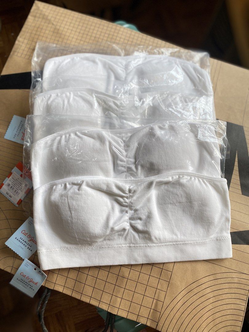 Cat & Jack White Seamless Bandeau Bra 4 Pack (Category: Undergarments & Loungewear) located in Batangas. Submitted by lux_kimmy (Listing ID 1470967892, Image 2). Description: - Brand: Cat & Jack - Quantity: Set of 4 seamless bandeau bras - Size: Medium (M) - Condition: Brand new, still in original plastic wrappers with tags attached - Material: Soft ribbed stretch fabric with gathered center detail - Comfort: Wireless design, perfect for daily we