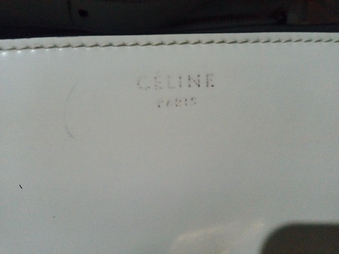 Celine Paris White Leather Shoulder Bag (Category: Luxury Bags & Wallets) located in Manila. Submitted by littlelove25 (Listing ID 1471096419, Image 2). Description: - Authentic Celine Paris white leather shoulder bag - Elegant gold-tone metal clasp closure with engraved branding - Adjustable shoulder strap for comfortable wear - Clean, structured classic flap silhouette - Interior features a handy zipper pocket and gold foil stamp logo under the