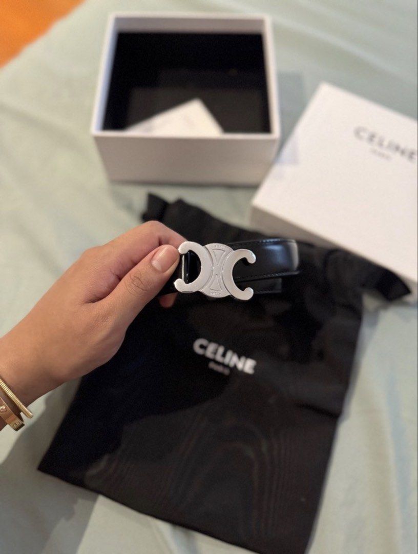 Celine Triomphe Black Leather Belt with Silver Buckle (Category: Belts) located in Manila. Submitted by azcheeese (Listing ID 1471105449, Image 1). Description: - Brand: Celine - Material: Black leather - Hardware: Iconic silver Triomphe buckle - Inclusions: Original dust bag, presentation box, and papers - Condition: Impeccably stored in its box - Styling: Versatile piece that pairs effortlessly with both jeans and dresses.