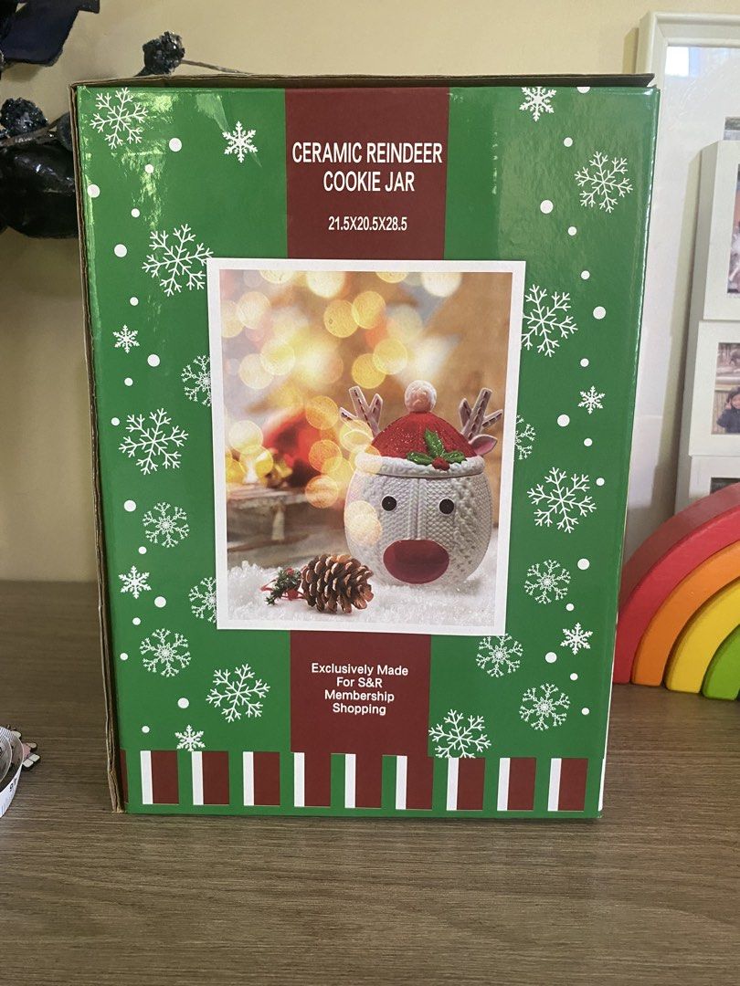 Ceramic Reindeer Cookie Jar Christmas S&R (Category: Food Organization & Storage) located in Santa Rosa. Submitted by hoardqueensdeclutter (Listing ID 1470932885, Image 2). Description: - Brand new item, still in original green snowflake box - Festive reindeer container wearing a Santa hat with cute red nose and antlers - Made of white ceramic with a cozy knit texture pattern - Exclusively made for S&R Membership Shopping - Dimensions: 21.5 x 20.