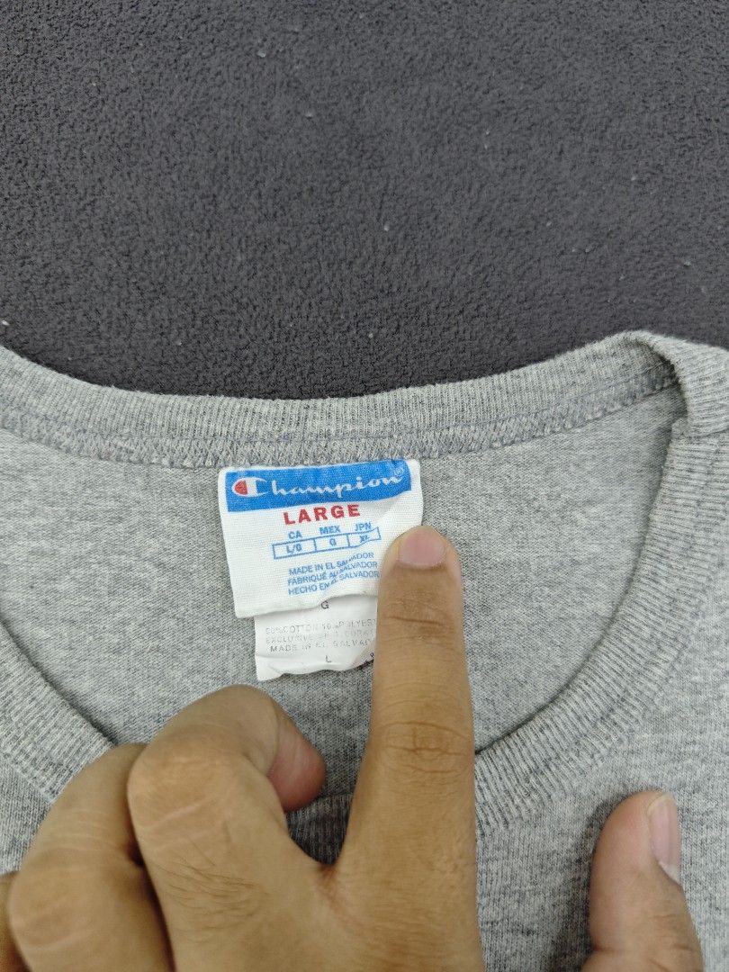 Champion Heather Grey Script Logo T-Shirt (Category: Tshirts & Polo Shirts ) located in Bulacan. Submitted by pzj_thrift (Listing ID 1470968163, Image 2). Description: condition 9/10 color rate 9/10 no issue.