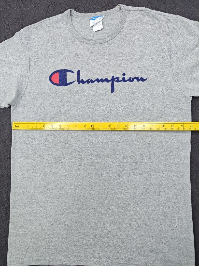 Champion Heather Grey Script Logo T-Shirt (Category: Tshirts & Polo Shirts ) located in Bulacan. Submitted by pzj_thrift (Listing ID 1470968163, Image 3). Description: condition 9/10 color rate 9/10 no issue.