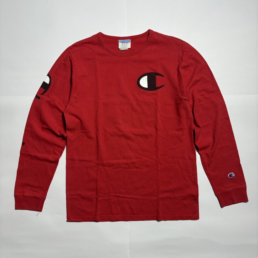 Champion Red Long Sleeve T-Shirt Medium (Category: Tshirts & Polo Shirts ) located in San Fernando. Submitted by lumang_gamit (Listing ID 1471065457, Image 1). Description: - Brand: Champion - Color: Red - Size: Medium (Made in Honduras) - Design: Big C logo on chest, text graphic on right sleeve, and embroidered patch on left cuff - Details: Ribbed collar and cuffs for a comfortable fit - Condition: Excellent, ready to wear.