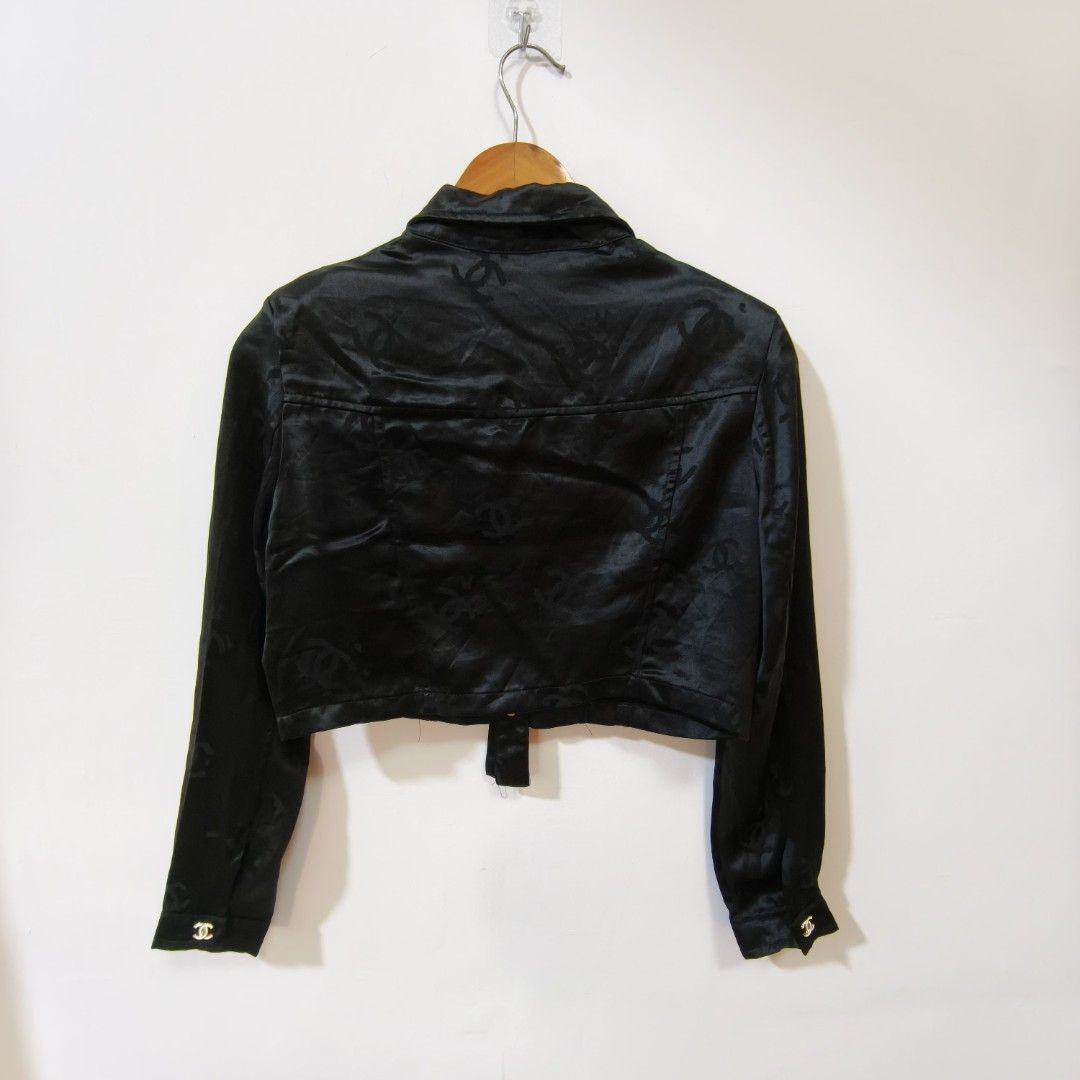 Chanel Black Monogram Silk Cropped Jacket (Category: Coats, Jackets and Outerwear) located in Quezon City. Submitted by inrelationthrift (Listing ID 1471028670, Image 3). Description: - Brand: Chanel - Material: Luxurious black silk with subtle woven CC monogram - Design: Cropped length, pointed lapel collar, button-up front - Pockets: Dual chest flap pockets - Hardware: Gold-toned buttons engraved with the iconic CC logo - Sleeves: Long sleeves 