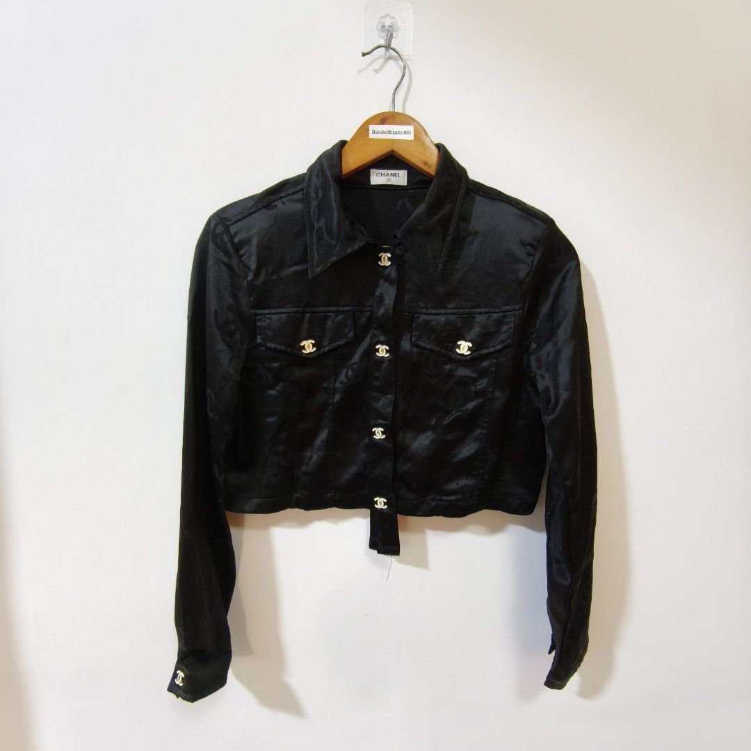 Chanel Black Monogram Silk Cropped Jacket (Category: Coats, Jackets and Outerwear) located in Quezon City. Submitted by inrelationthrift (Listing ID 1471028670, Image 1). Description: - Brand: Chanel - Material: Luxurious black silk with subtle woven CC monogram - Design: Cropped length, pointed lapel collar, button-up front - Pockets: Dual chest flap pockets - Hardware: Gold-toned buttons engraved with the iconic CC logo - Sleeves: Long sleeves 