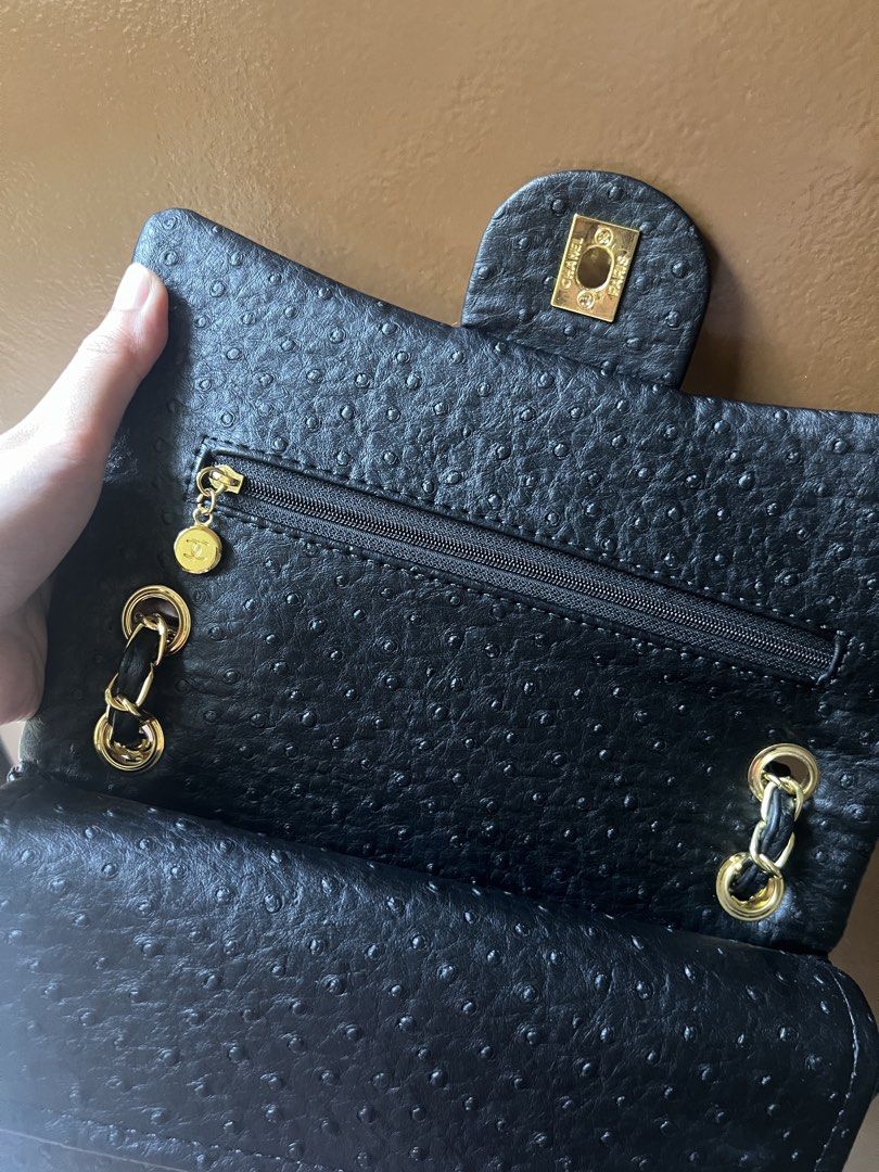 Chanel Classic Flap Ostrich Leather Handbag (Category: Luxury Bags & Wallets) located in Manila. Submitted by jisboring (Listing ID 1467213312, Image 2). Description: DM FOR MORE PHOTOS NEGO! - Brand: Chanel Shoulder Bag - Material: black ostrich leather with distinct quill follicle pattern - Hardware: Gold-tone with iconic CC turn-lock closure - Strap: Intertwined chain with leather threading - Design: Classic structured flap silhouette with cle