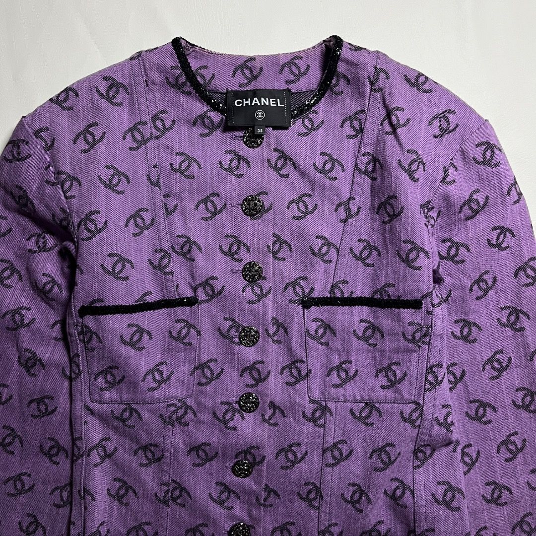 Chanel Purple CC Monogram Denim Jacket Size 38 (Category: Coats, Jackets and Outerwear) located in Caloocan City. Submitted by achilles_grails (Listing ID 1471048436, Image 2). Description: - Authentic Chanel jacket in a striking purple shade covered in iconic black CC logos - Made in Italy with 100% premium cotton and a luxurious silk lining - Size: 38 (EU/FR) - Features a classic button-up front, functional front pockets, and chic textured trim