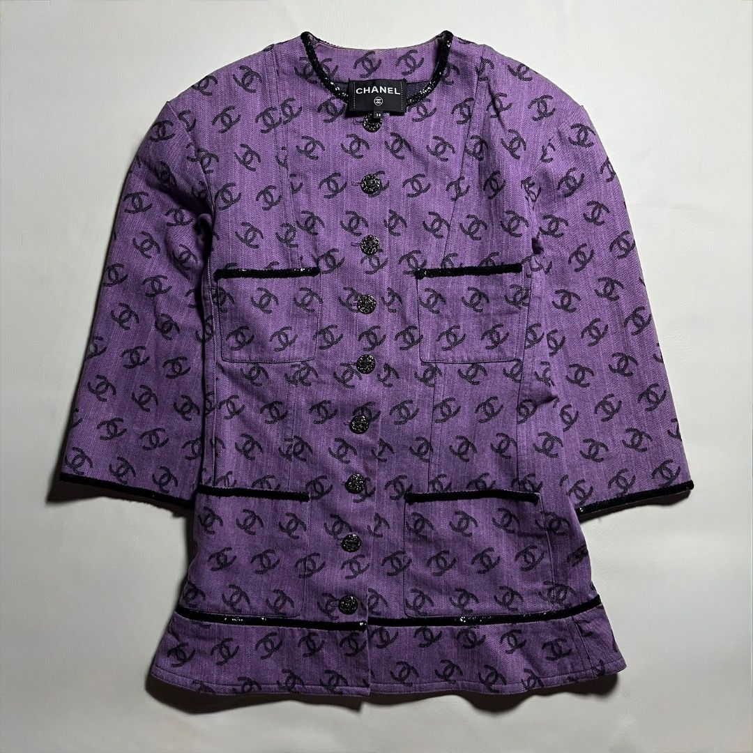 Chanel Purple CC Monogram Denim Jacket Size 38 (Category: Coats, Jackets and Outerwear) located in Caloocan City. Submitted by achilles_grails (Listing ID 1471048436, Image 1). Description: - Authentic Chanel jacket in a striking purple shade covered in iconic black CC logos - Made in Italy with 100% premium cotton and a luxurious silk lining - Size: 38 (EU/FR) - Features a classic button-up front, functional front pockets, and chic textured trim