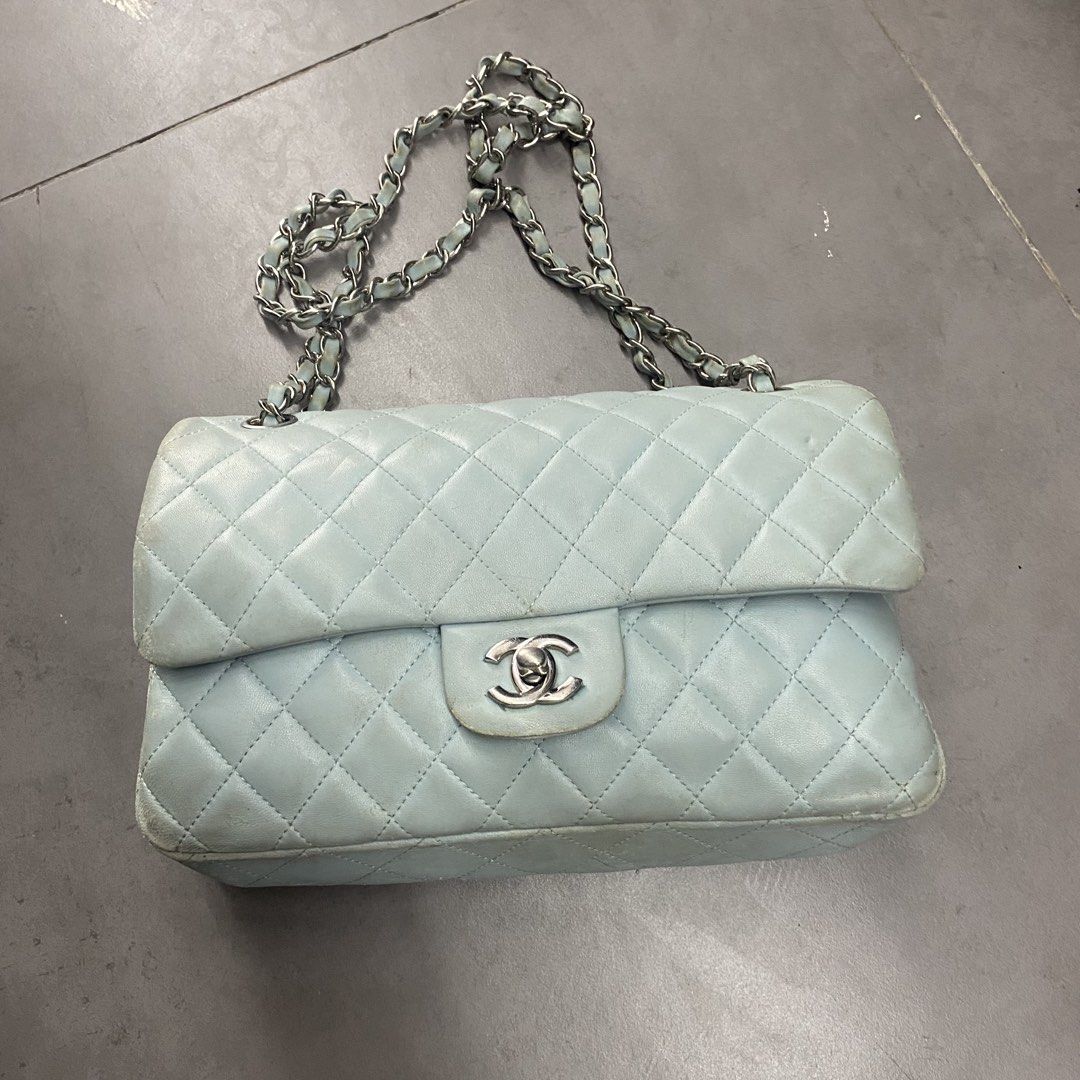Chanel Quilted Light Blue Classic Flap Bag (Category: Luxury Bags & Wallets) located in Manila. Submitted by 5treetw3ar (Listing ID 1470953903, Image 1). Description: - Chanel Classic Double Flap bag - Light blue quilted leather with silver-tone hardware and interwoven chain strap - Iconic CC turn-lock closure and convenient back slip pocket - Structure remains fully intact and sturdy - Flaws: Noticeable scuffing, color fading, and wear along the