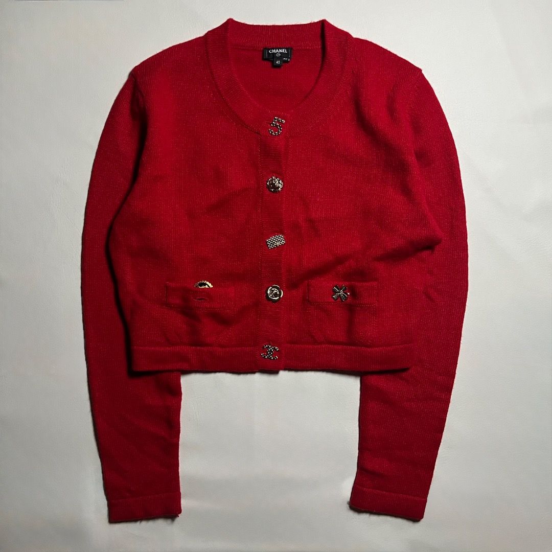 Chanel Red Cashmere Cardigan Size 40 (Category: Coats, Jackets and Outerwear) located in Caloocan City. Submitted by achilles_grails (Listing ID 1471052437, Image 1). Description: - Brand: Chanel - Material: 100% Cashmere (super soft knit) - Color: Bright Red - Size: 40 - Style: Crew neck cardigan with button closure - Special Details: Assorted decorative metal buttons and two small front pockets with clover and flower charms - Finishes: Ribbed c