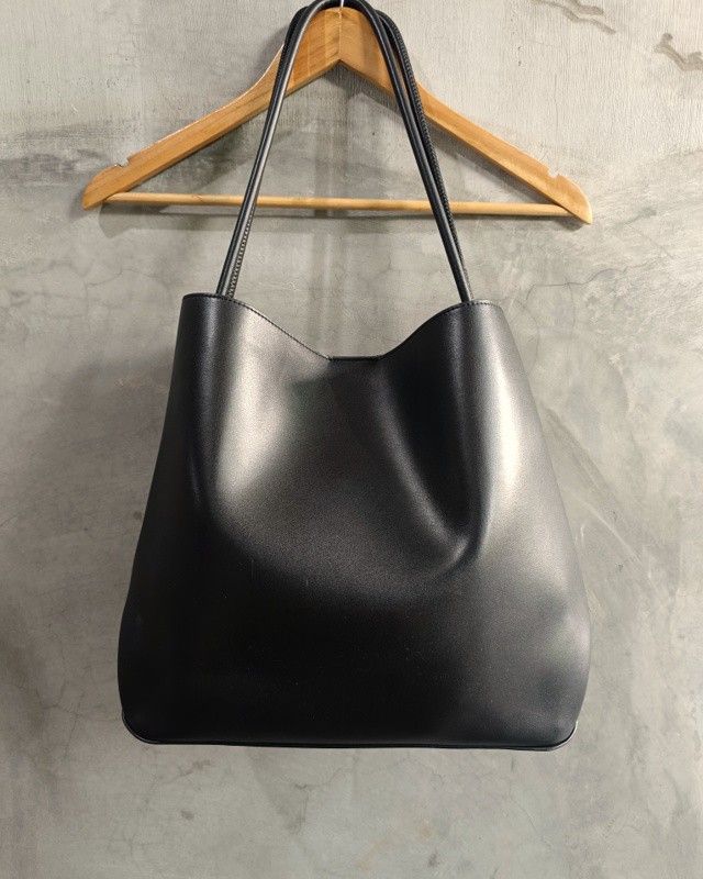 Charles & Keith Leia Black Leather Tote Bag (Category: Tote Bags) located in Bacoor. Submitted by nineties_kid (Listing ID 1471013839, Image 3). Description: •==> Charles & Keith Leia Black Leather Tote Bag Size: Large Bag width/dimension: 13 x 15.5 x 16.5 x 13.5 Bag length: 13 inches Bag space: 4.8 inches Strap length: 12 inches Issues: Scratches as a sign of use. Leather edges breakage. Bottom leather wrinkles. All issues provided in photos. __