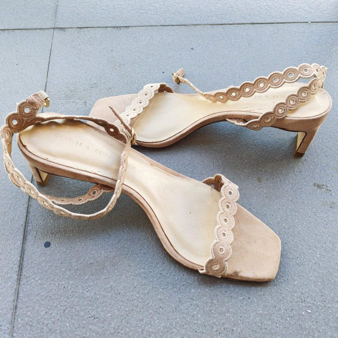 Charles & Keith Scalloped Ankle Strap Heels Size 38 (Category: Heels) located in Macabebe. Submitted by pampanga_chic (Listing ID 1470994933, Image 2). Description: Charles & Keith beige heels in size 38 featuring a chic square toe, scalloped embroidery straps, and a comfortable block heel with buckle ankle closure. Pre-loved with some visible wear on the soles and insole marks, but still a gorgeous pair for everyday wear or events!.