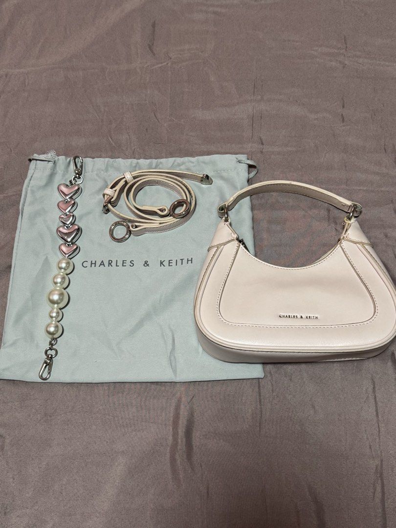 Charles and Keith Mini Hobo Bag Pink (Category: Luxury Bags & Wallets) located in Quezon City. Submitted by meecaisawesome (Listing ID 1471009431, Image 1). Description: Negotiable for sure buyers!.