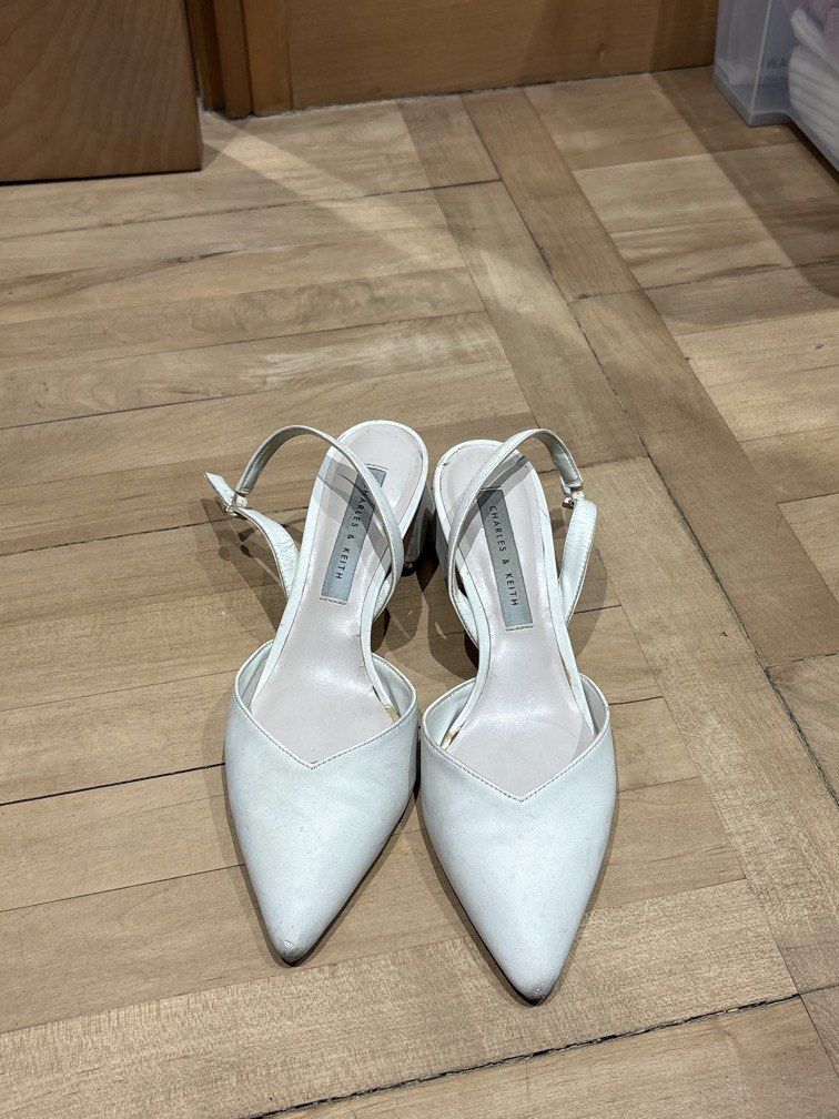 Charles and Keith White Heels (Category: Heels) located in Quezon City. Submitted by shopsabsee (Listing ID 1471065323, Image 1). Description: still wearable! haven’t used in a while.
