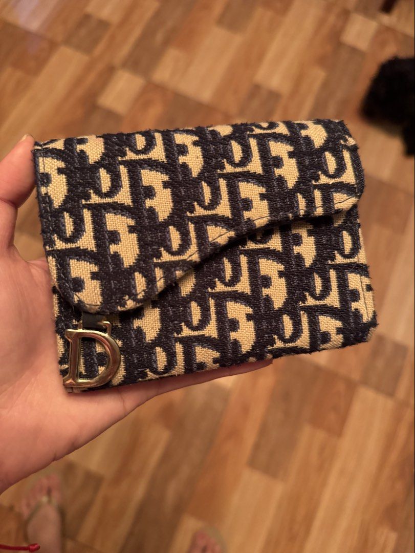 D navy blue wallet (Category: Wallets & Card holders) located in Pasig City. Submitted by decluttering_slay (Listing ID 1471066200, Image 1). Description: .