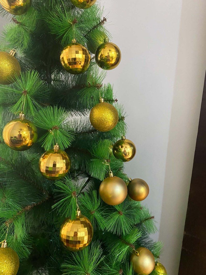 Christmas tree with accessories (Category: Looking For) located in Manila. Submitted by krisola33 (Listing ID 1470932271, Image 2). Description: ✨ Make your home Christmas-ready with this beautiful green Christmas tree decorated with elegant gold ornaments! 📌 Details: • Height: 6 feet • Color: Green with gold decorations • Condition: Used but still in good condition • Includes gold Christmas balls, star topper, metal stand, and other accessories