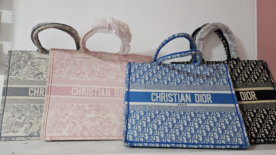 Chr*stian D*or Tote Bag Collection (Category: Tote Bags) located in Antipolo. Submitted by northernduke_710csn (Listing ID 1470932747, Image 1). Description: - Available items: 4 Christian Dior tote bags - Colors & Patterns: Toile de Jouy (Grey & Pink), Oblique (Blue & Black) - Design: Structured canvas style with heavy front lettering embroidery and sturdy top handles - Purchase options: Available individually or as a set - Note: Please send a m