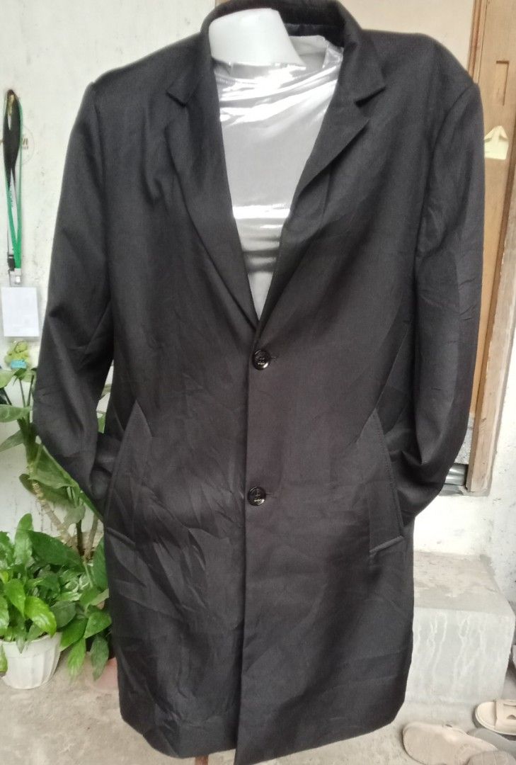 Classic Black Trench Coat Long Jacket Outerwear (Category: Coats, Jackets and Outerwear) located in Cavite. Submitted by garinmaric11231 (Listing ID 1470959460, Image 2). Description: - Color: Classic Black - Style: Long trench coat jacket with structured shoulders - Features: Lapel collar, front button closure, and functional side pockets - Fabric: Clean dark fabric, ideal for cooler weather - Versatility: Easy to layer over sweaters or shirts; 