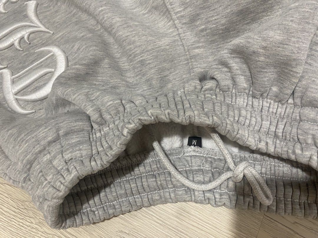 CLB Grey Sweatshorts Embroidered Gothic Font Size M (Category: Shorts) located in Caloocan City. Submitted by heatedcaps4425 (Listing ID 1471098881, Image 3). Description: - Size: Medium - Color: Grey - Material: Thick cotton with soft fuzzy fleece interior - Design: Embroidered CLB lettering in old English font on the side leg - Waistband: Elastic with internal drawstring - Condition: Clean, zero stains, and no loose threads.