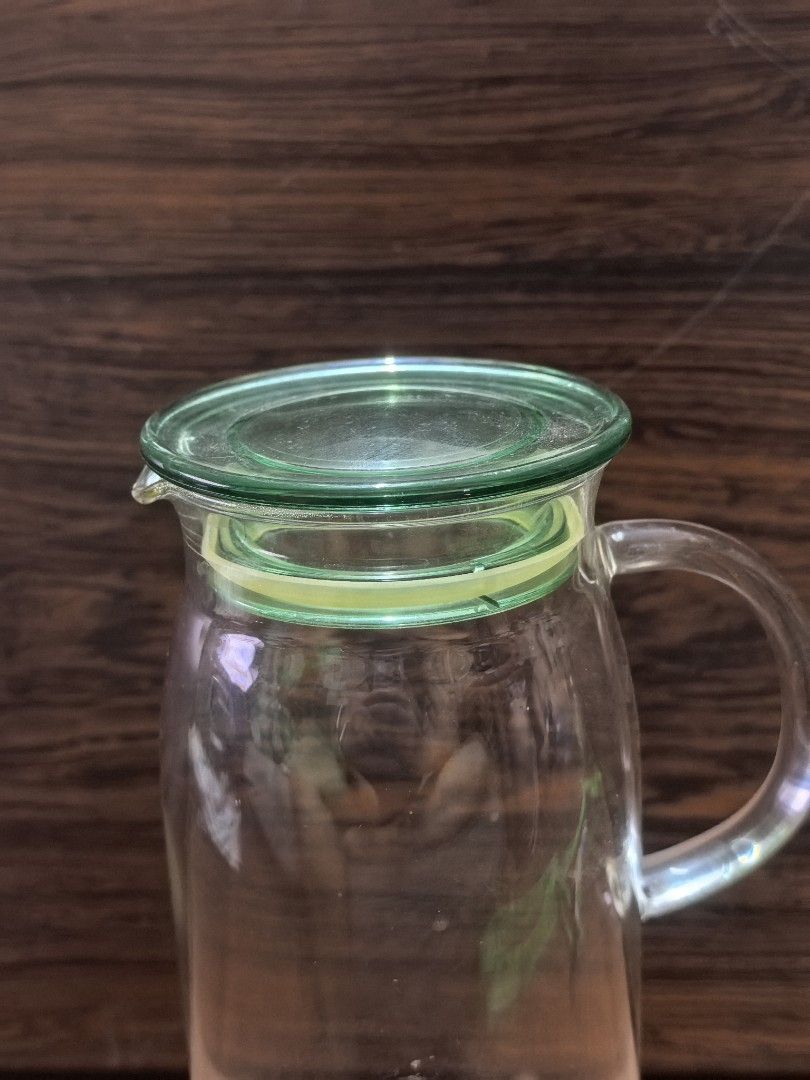 Clear Glass Pitcher with Green Lid (Category: Pitchers & Dispensers) located in Rizal. Submitted by gkstcenit (Listing ID 1471073225, Image 2). Description: - Clear glass pitcher with a vibrant green lid and handle - Stands about 10 inches tall - Perfect for water, iced tea, juice, or everyday dining - Simple, user-friendly design for easy pouring - Clean glass body, no cracks.