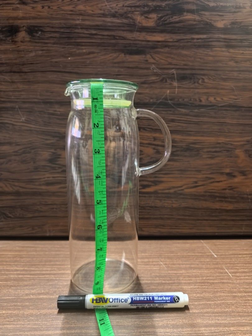 Clear Glass Pitcher with Green Lid (Category: Pitchers & Dispensers) located in Rizal. Submitted by gkstcenit (Listing ID 1471073225, Image 1). Description: - Clear glass pitcher with a vibrant green lid and handle - Stands about 10 inches tall - Perfect for water, iced tea, juice, or everyday dining - Simple, user-friendly design for easy pouring - Clean glass body, no cracks.