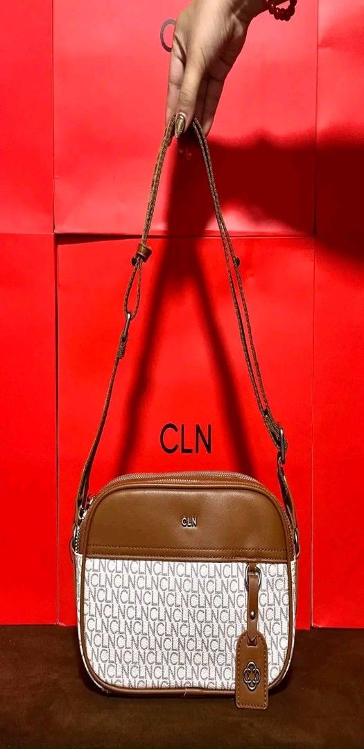 CLN Brown and Monogram Crossbody Bag (Category: Cross-body Bags) located in Manila. Submitted by silvermoon_b802e0 (Listing ID 1470963684, Image 1). Description: - Brand: CLN - Design: Brown and cream monogram print with leather-like top panel - Hardware: Silver CLN logo and matching hanging tag charm - Compartment: Zippered main compartment with front pocket area - Strap: Adjustable long strap - Condition/Shape: Clean stitching, structured shape