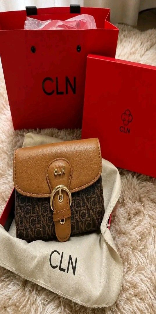 CLN Monogram Print Wallet with Buckle (Category: Wallets & Card holders) located in Manila. Submitted by silvermoon_b802e0 (Listing ID 1470965964, Image 2). Description: - Brand: CLN - Color: Tan brown with gold hardware - Design: Monogram pattern with decorative buckle flap - Condition: Brand new, unused, and kept in packaging - Inclusions: Original dust bag, branded red presentation box, and matching paper gift bag.