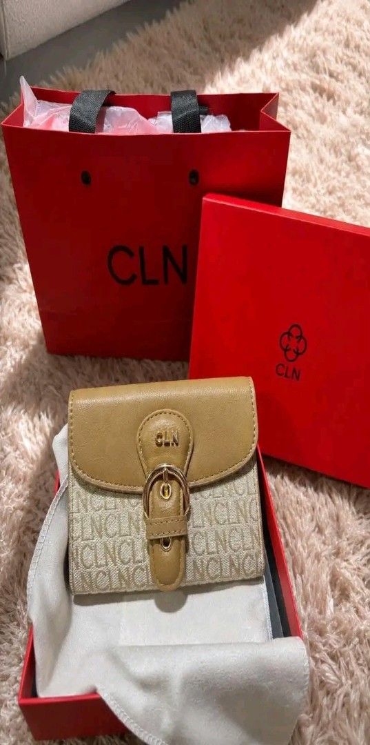 CLN Monogram Print Wallet with Buckle (Category: Wallets & Card holders) located in Manila. Submitted by silvermoon_b802e0 (Listing ID 1470965964, Image 1). Description: - Brand: CLN - Color: Tan brown with gold hardware - Design: Monogram pattern with decorative buckle flap - Condition: Brand new, unused, and kept in packaging - Inclusions: Original dust bag, branded red presentation box, and matching paper gift bag.
